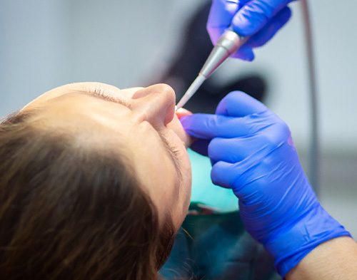 Person undergoing dental work while under oral conscious sedation