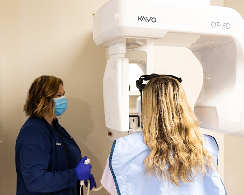 Dental team member taking a digital scan of a dental patient in Jenks