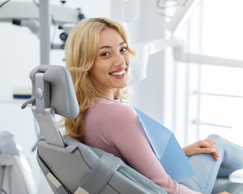 Closeup of smiling patient sitting in treatment chair