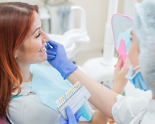 Patient getting shade-matched for dental crown