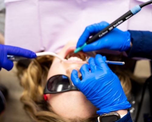 Dental team treating a patient with a dental emergency