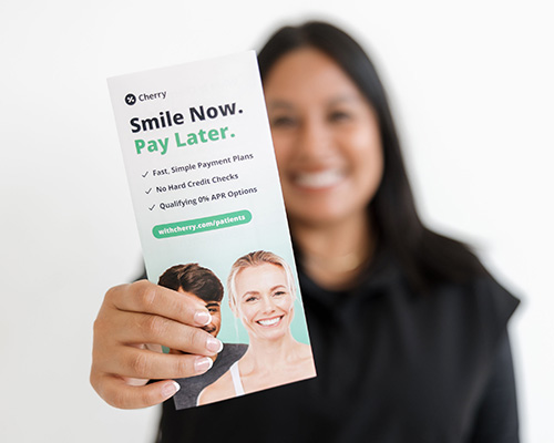 Smiling dental staff member talking on phone