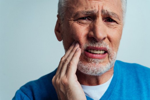 Patient in Glenpool wincing due to cavity