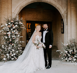 Doctor Salayta smiling with his wife at their wedding