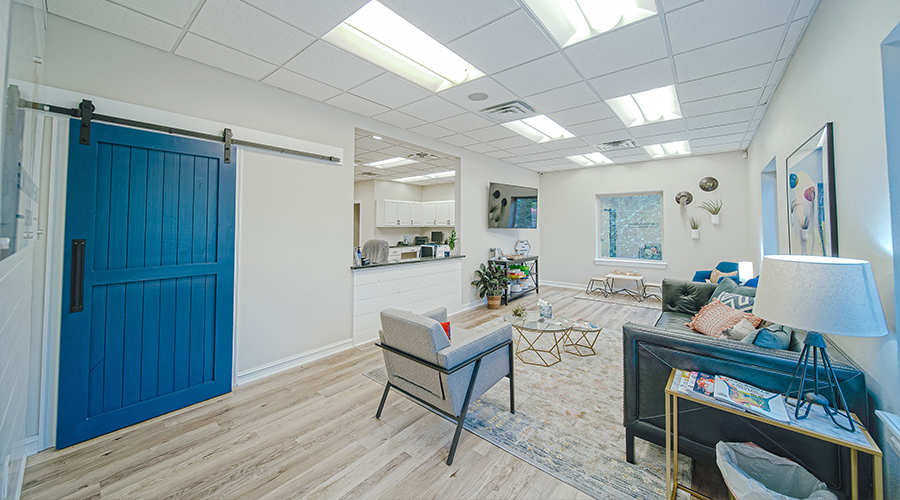 White and blue waiting room in at Elwood Avenue Dental