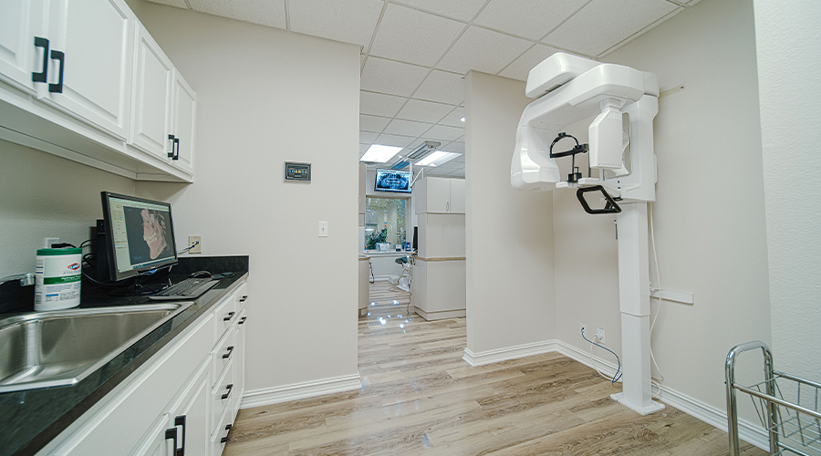 Cone beam dental scanning device in dental office hallway