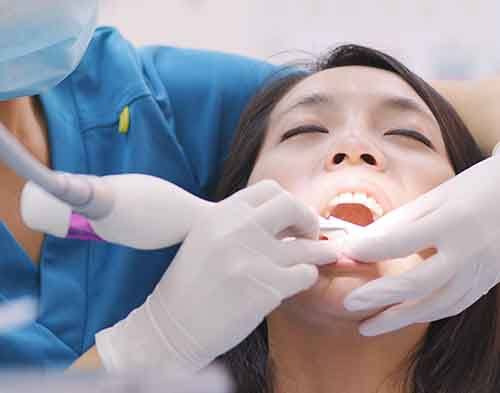 Root scaling and planing is typically performed in two dental appointments