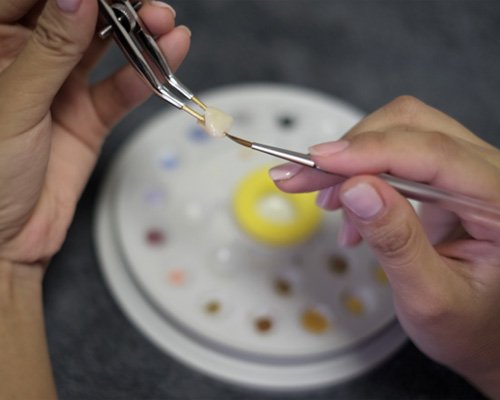 A dental technician working on a same-day dental crown