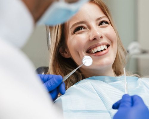 Lady smiles at dentist